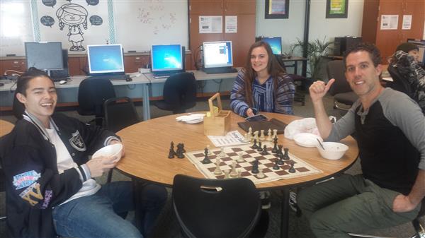 Students playing chess in the lab